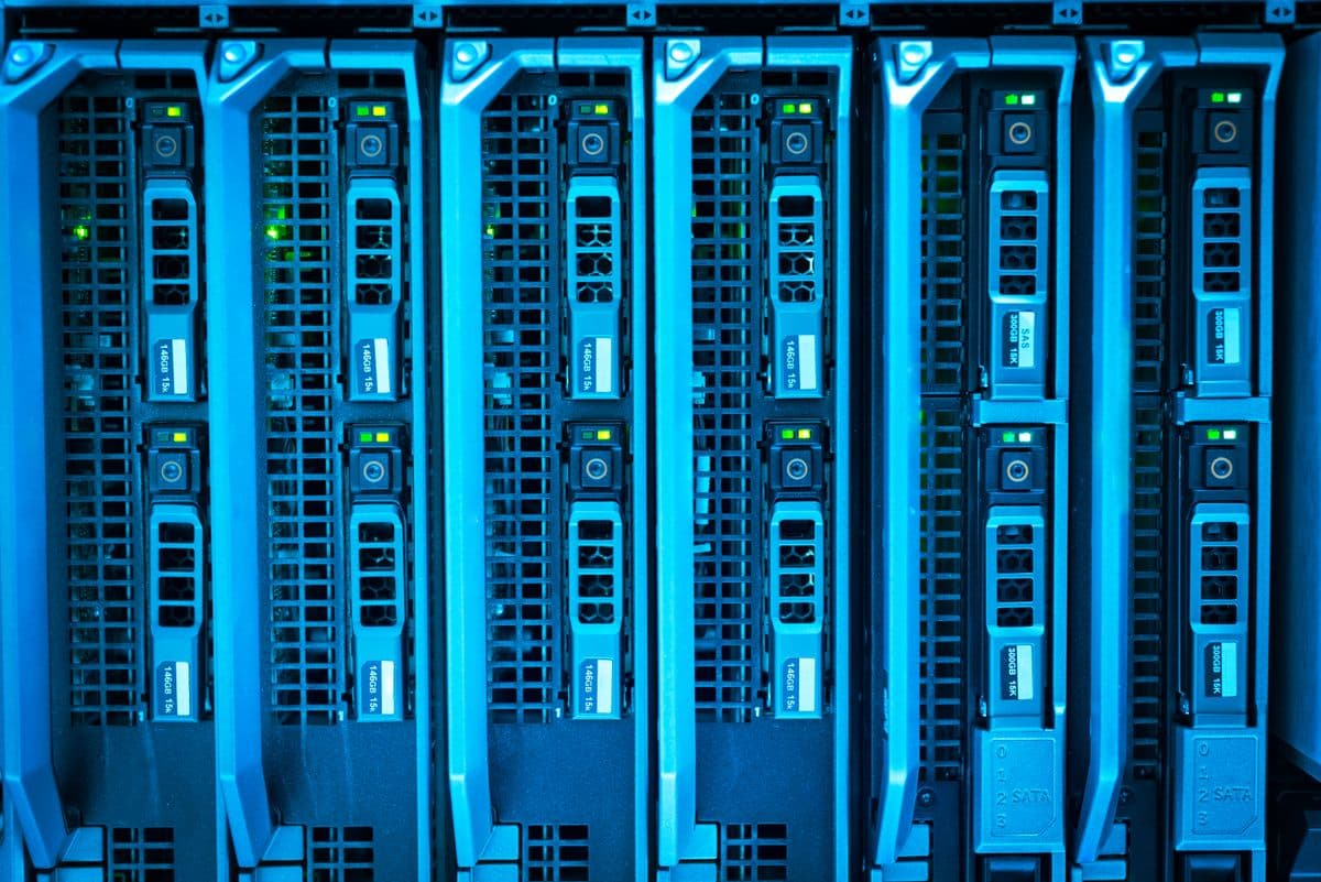 Rows of illuminated server racks in a data centre